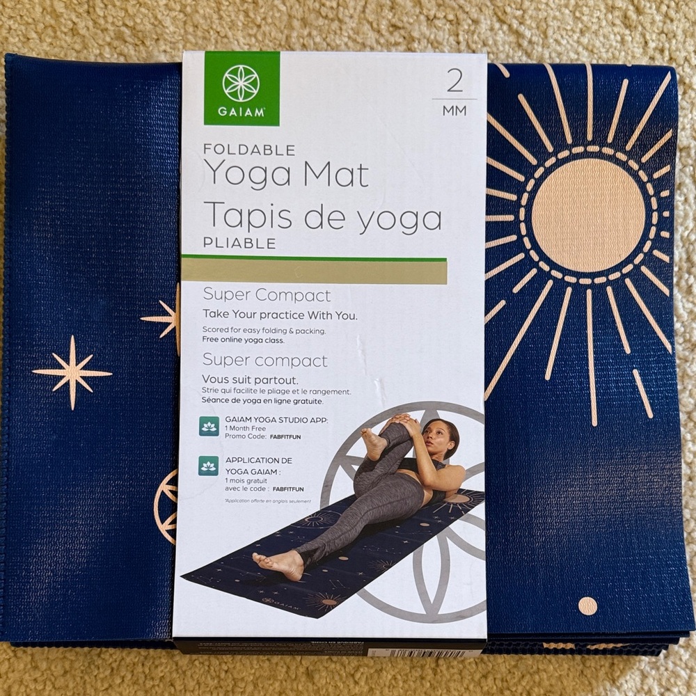 GAIAM Compact Foldable Yoga Mat in Navy with Sunburst Design